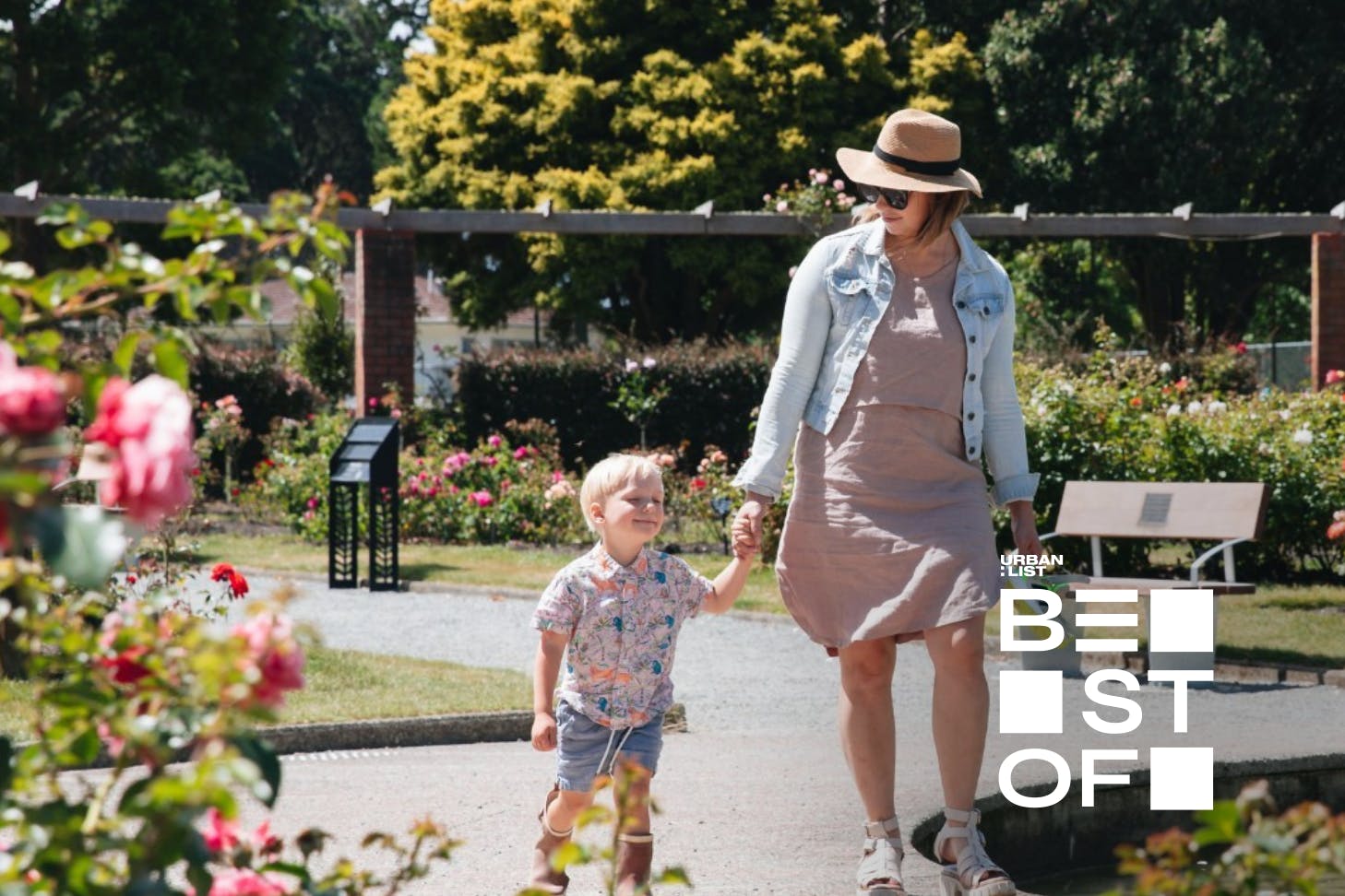 mother and child walk hand in hand through wellington botanic gardens